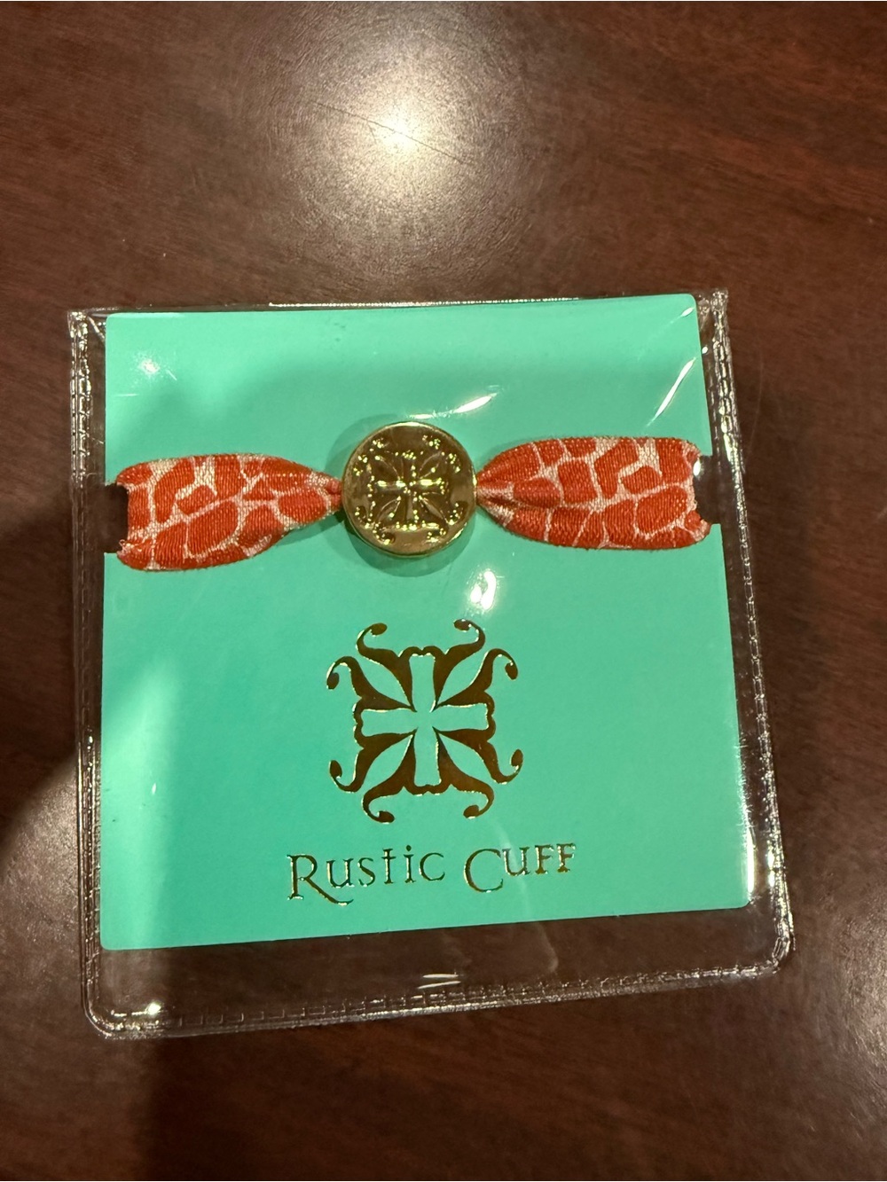 Rustic Cuff Orange Giraffe-Print Elastic Hair Tie with Gold Medallion